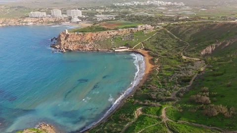 Gorgeous drone view of Riviera Beach, Għajn Tuffieħa, Malta with turquoise Stock Footage 330832336