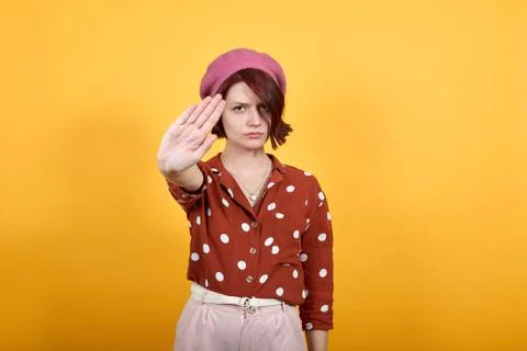 Gorgeous elegant lady doing stop sing with palm of the hand. Warning expression. Stockfoto's