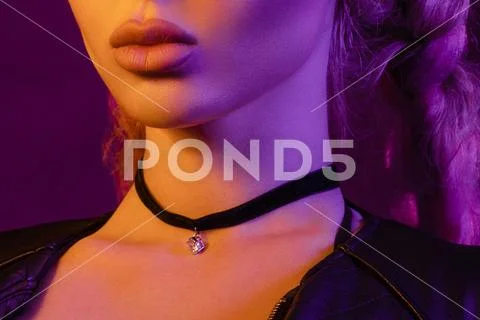 Gorgeous fashionable woman in the lights. pink and yellow light Stock Photos