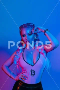 Gorgeous fashionable woman in the lights.blue and red light Stock Photos