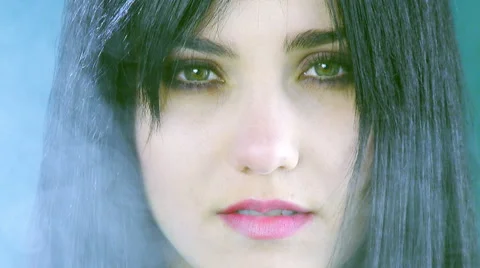 Gorgeous female model looking camera with fog backwards tracking shot Stock Footage 50060731
