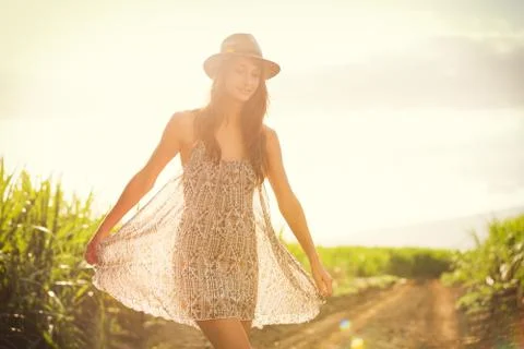 Gorgeous girl walking in the field, summer lifestyle Stock Photos