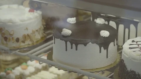 Gorgeous handmade cakes in a case Stock Footage 73903032