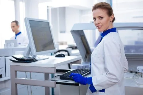 Gorgeous intelligent scientist testing the samples Stock Photos