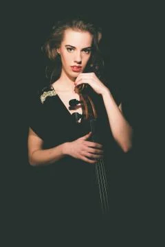 Gorgeous Lady Musician Holding on her Cello Stock Photos