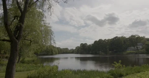 A gorgeous lake during an overcast, spring day Video stock 154756071