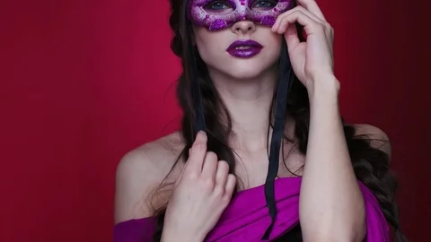Gorgeous model with glamorous make-up in carnival glasses Stock Footage 77730372