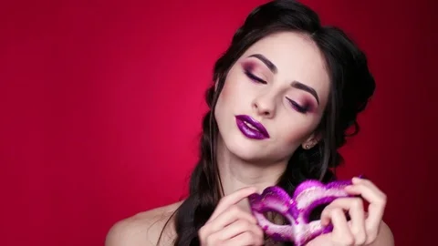 Gorgeous model with glamorous make-up in carnival glasses Stock Footage 77733422