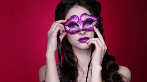 Gorgeous model with glamorous make-up in carnival glasses Stock Footage 77974154