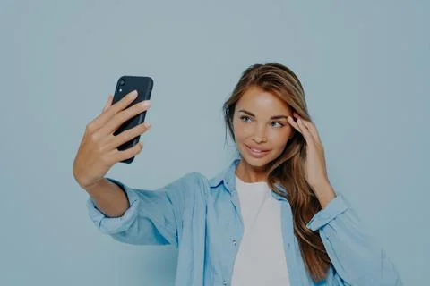 Gorgeous model making selfie on mobile phone Foto stock
