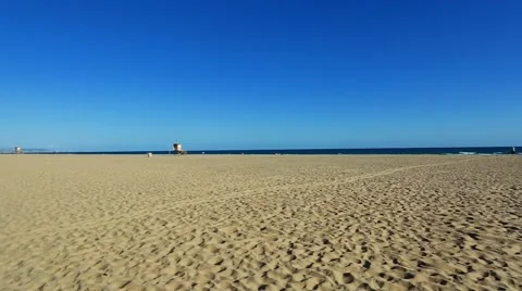 Gorgeous pan of a beach on a beautiful day Stock Footage 65317411
