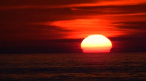Gorgeous red sun setting behind ocean waters Stock-Footage 45521664