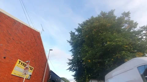 Gorgeous Sky and Clouds over City of England During Car Drive Stock Footage 318844276