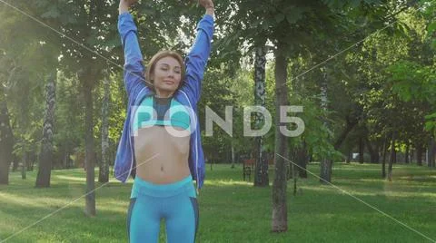 Gorgeous sportswoman breathing fresh air outdoors in the morning Stock Photos