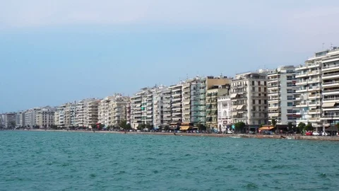 Gorgeous steady low angle view on crowded modern villas hotel sea front quay of Stock-Footage 94924256