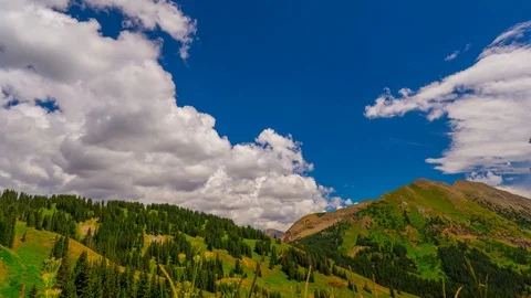Gorgeous Summer Mountain Peak of Soft Grass and deep blue skies Time Lapse 4K Stock Footage 129357037
