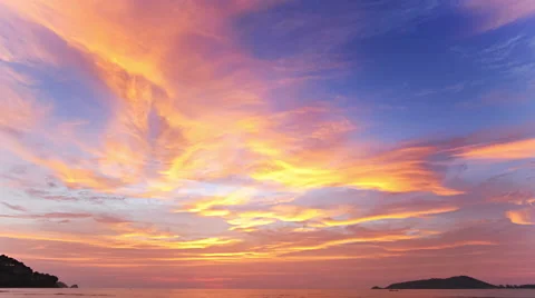 Gorgeous sunrise over tropical sea. Timelapse of moving clouds on dramatic sky Stock Footage
