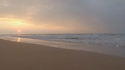 Gorgeous sunset on the beach and foamy sea waves Stock Footage 121838331