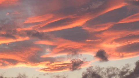 Gorgeous sunset Clouds with dark clouds moving beneath Stock Footage 252093997