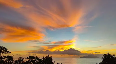 Gorgeous sunset in Seychelles, rectangular frame clouds, copy space Stock Photos