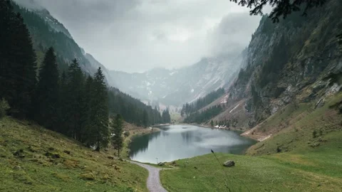 Gorgeous Timelapse on a rainy day on a tiny alpine lake in Switzerland, panorama Stock Footage 194047814