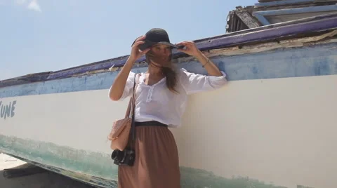 Gorgeous Top Model Posing Next To Old Wooden Boat Stock Footage 47858254
