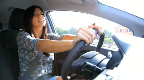 Gorgeous woman singing driving car happy Stock Footage