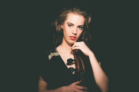 Gorgeous young cellist with her cello Stock Photos