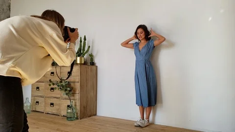 Gorgeous Young Mixed Model Making Faces Posing for the Camera at a Photo Shoot Stock Footage 122991227