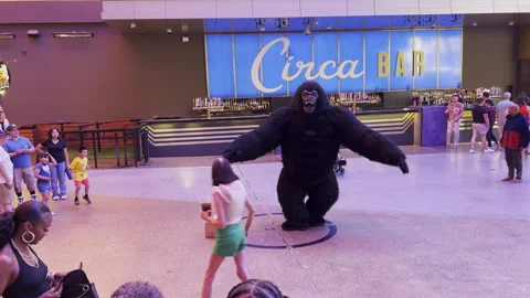 Gorilla street performer dancing in front of Circa Bar 4k Stock Footage 285990625