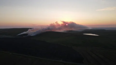 A gorse fire at sunset in the Irish mountains. Bragan, Monaghan, Ireland Stock Footage 274748758
