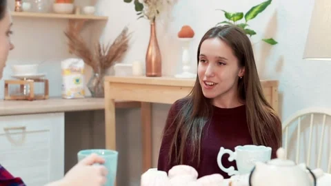 Gossip with girlfriend at cup of tea Stock Footage 176337495