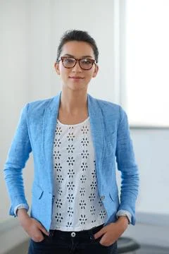 Got my eye on a well-designed future. Confident young businesswoman looking Stock Photos