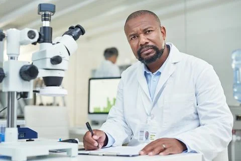 Got a question Science will answer it. Portrait of a mature scientist working in Stock Photos