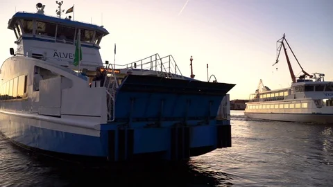 Gothenburg, Sweden - Oct 29, 2019 : Ferry passing Göta älv river at sunset Stock Footage