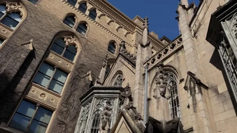 Gothic Architectural Masterpiece Reflecting Beautifully in Stained Glass Windows Stock Footage 295076550
