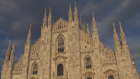 Gothic architecture Duomo cathedral facade on blue sky Milan touristic landmark Stock Footage 84743083