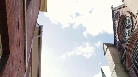 Gothic Architecture of Lichfield Cathedral contrasted opposite modern town Stock-Footage 73497068