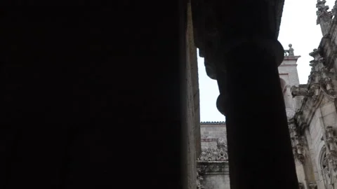 Gothic architecture in an old stone courtyard with intricate carvings Stock Footage 288003315
