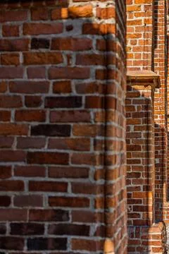 Gothic brick facade with historic architectural details Фото