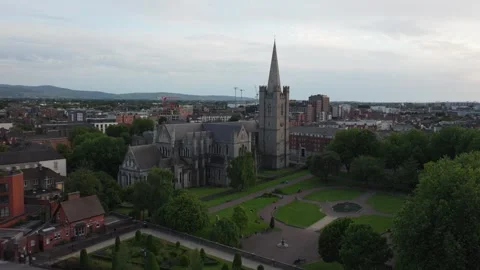 Gothic Cathedral and Formal Gardens Framed by Trees in Central Dublin Stock Footage 337972673
