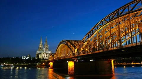 Gothic Cathedral and iron bridge across Rhine river after sunset Stock Footage 51376629