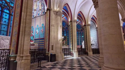 Gothic cathedral arches and stained glass windows in Notre Dame Cathedral in Stock Footage 307183465
