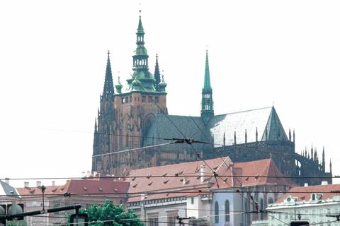 Gothic cathedral over city rooftops 스톡 사진
