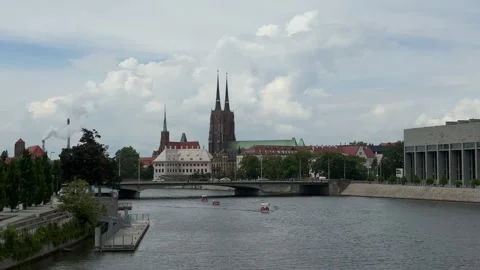 Gothic cathedral with twin spires viewed across the river in Wroclaw Stock Footage 310796959