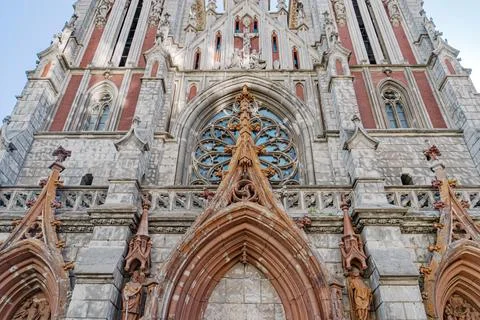 Gothic cathedral under sunlight, old Roman Catholic church, rose window, st.. Stock Photos