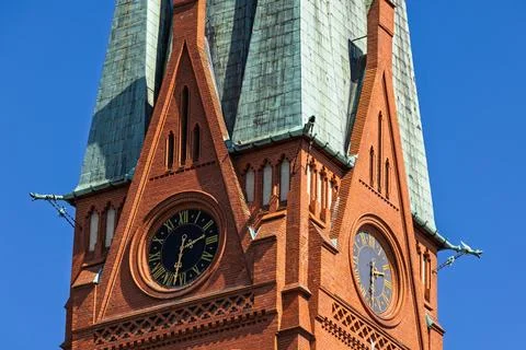 Gothic clock tower of Saint Catherine Church in Torun old town Fotos Stock