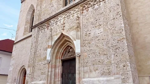 Gothic entrance and stone facade of the Church of St. Cantianus in Kranj Stock Footage 339092107