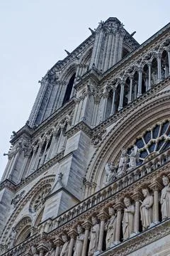 Gothic facade and rose window details of Notre Dame de Paris in France Stock Photos