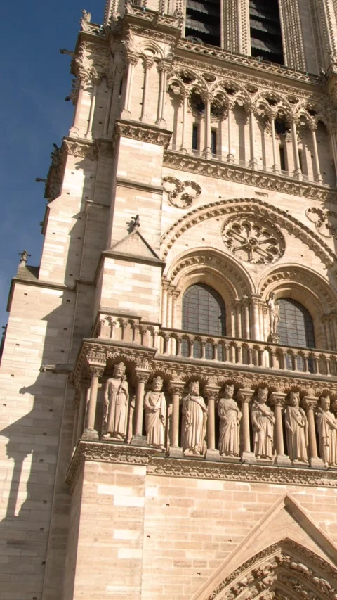 Gothic Facade and Sculptures of Notre Dame Cathedral in Paris Vídeos de archivo 344939514